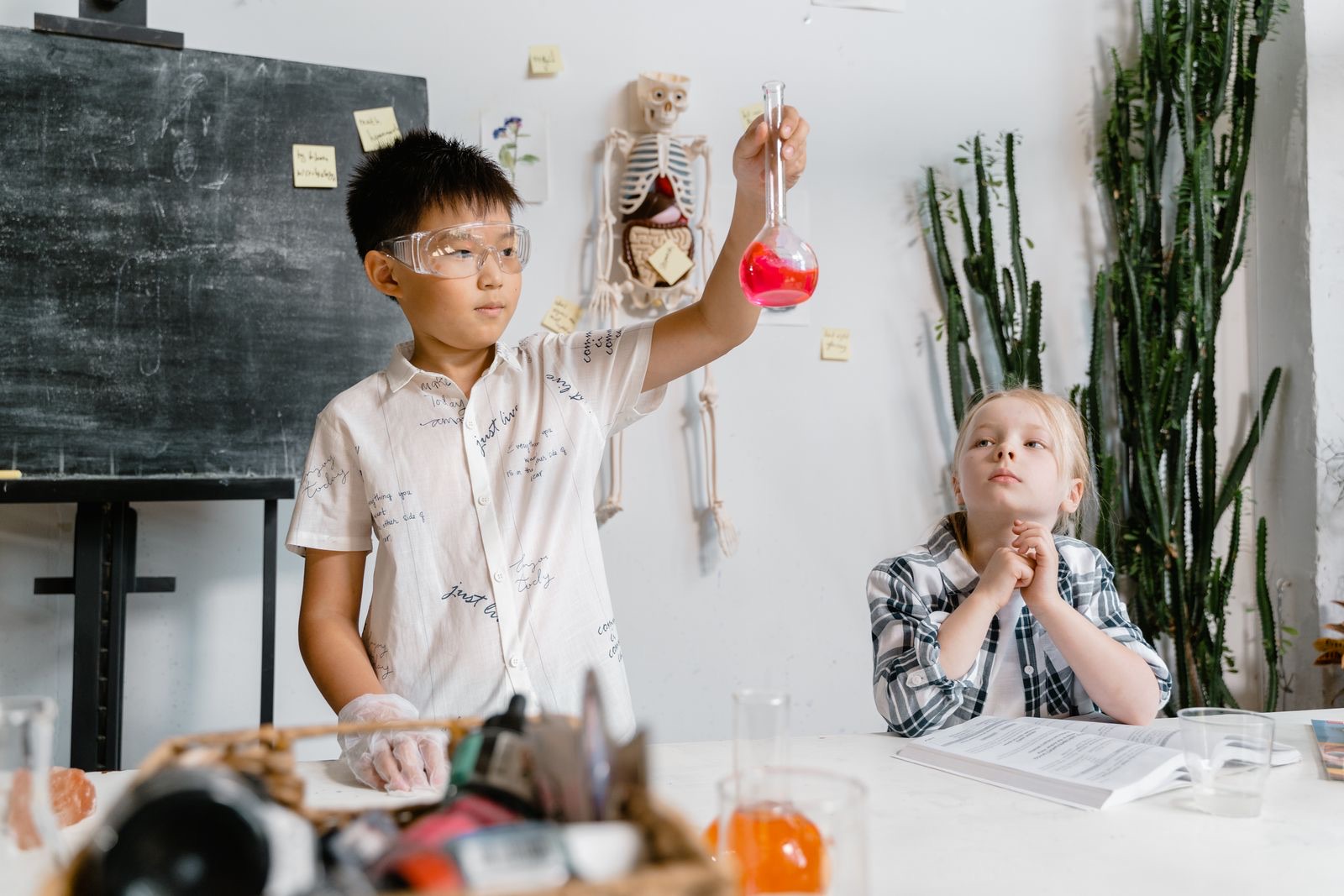 Children running a science experiment in a classroom