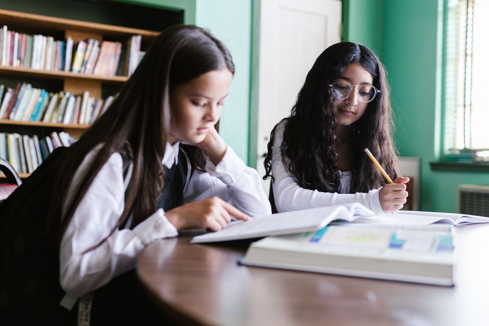 Two students studying together at a table